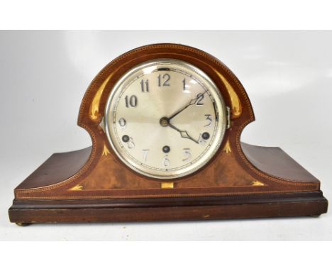 A large mahogany Napoleon hat chiming mantel clock, the silvered dial set with Arabic numerals and three wind holes to the fr