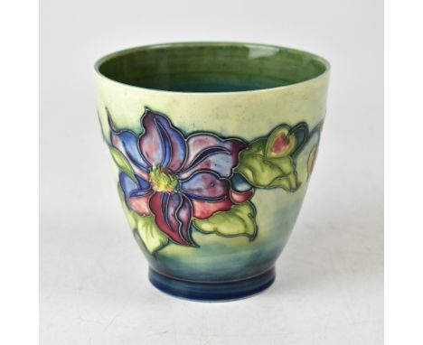 MOORCROFT; a planter in the 'Clematis' pattern on green/blue ground, height 13cm.