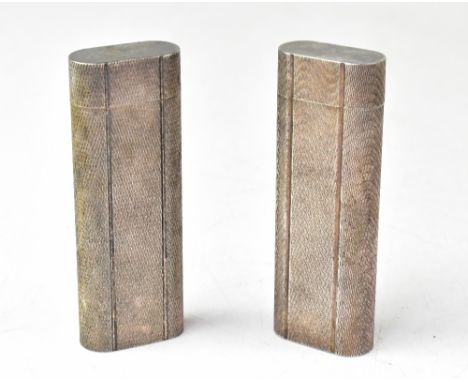 CARTIER; two lighters both a silvered colour and each with engine turned decoration, length 7.2cm (2). CONDITION REPORT: Plea