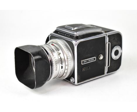 A Hasselblad 500C medium format film camera, serial no.TP 52824, fitted with a Carl Zeiss Planar 1:2.8 f=80mm lens, with Hass