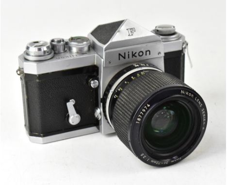 A Nikon F SLR camera, fitted with a Nikon Series E 36-72mm 1:3.5 zoom lens. CONDITION REPORT: The camera body shows signs of 