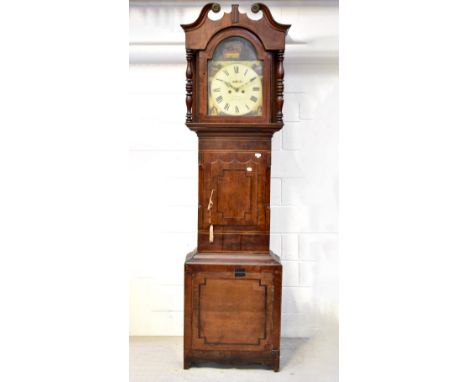 An early/mid-19th century oak, mahogany crossbanded and inlaid eight day longcase clock, the arched painted dial inscribed 'J