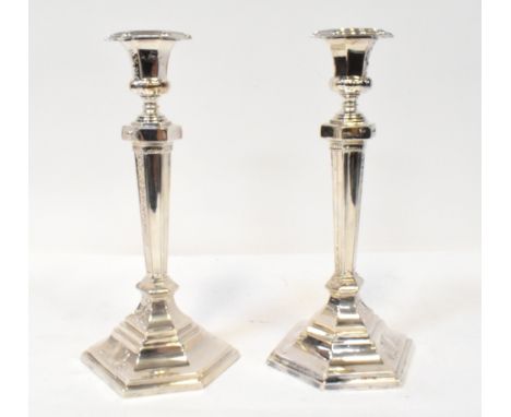 An impressive pair of Victorian 19th century hallmarked silver candlesticks, the urn-shaped sconces on hexagonal topped Corin