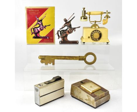 Five vintage table lighters to include a Nanyan Centaur example in original box, a vintage-style telephone musical lighter, a