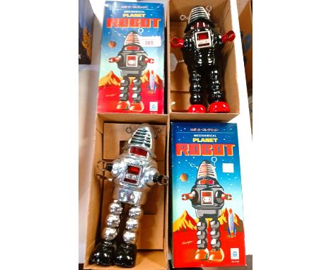 Two clockwork tinplate Mechanical Planet reproduction robots (one silver, #16060, one black) model MS-430 from the Schylling 