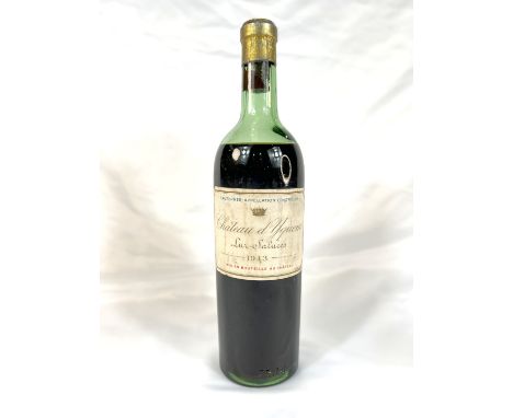 A vintage bottle of Chateau d'Yquem Lur Saluces 1943, seal appears intact, wine at shoulder level - see images