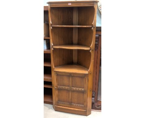 An Ercol full-height corner cupboard and wall hanging corner cupboard.