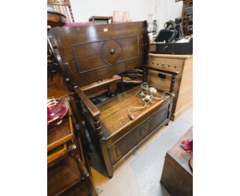 A 1930's oak monks bench