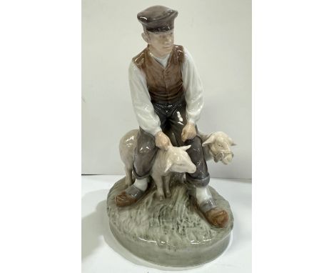 A Royal Copenhagen ceramic group Shepherd and sheep No 627