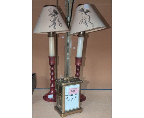 A small late 19th/early 18th century carriage clock; a pair of candle lamps.