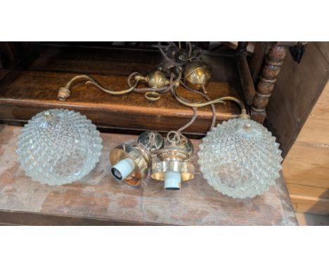 A 19th brass rise and fall ceiling light with counter weights