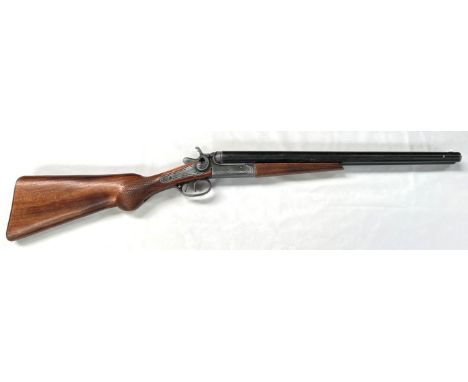 A model of a double barrel shotgun, with breaking barrel etc