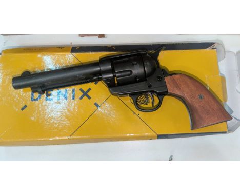 A Denix boxed model of a revolver