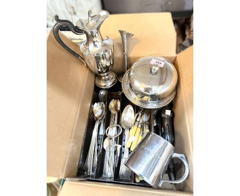 A selection of silver plate including muffin dish, claret jug, tankard etc, dog nut cracker, a quantity of cutlery.