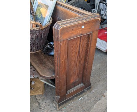 A large long 19th century pitch pine pew.