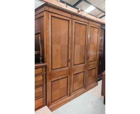 A 19th century light wood with quarter veneered panel triple campaign wardrobe with mirror door and two others, length 190cm,