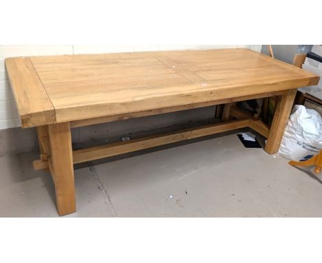 A modern light oak rectangular top dining table on heavy square legs, length 222cm.