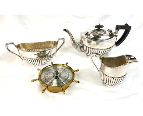 A three piece Georgian style tea service and a barometer