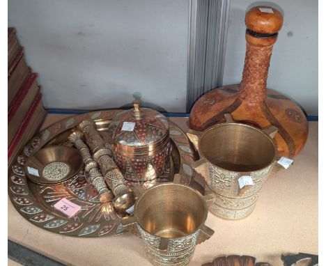 A Middle Eastern brass plate and covered vase with copper and white metal relief decoration; other brassware and a leather co