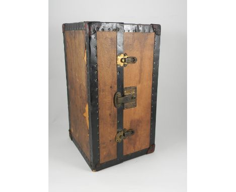 Dolls travel trunk, circa 1920, wooden trunk with paper leather effect exterior, opens with catch to wardrobe with wooden han