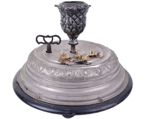 A musical revolving Christmas tree stand,German, circa 1900, playing two traditional festive airs, pressed nickel cover, cast
