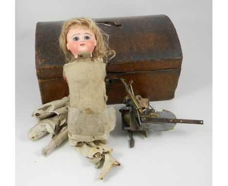 Rare kicking Steiner mechanical bisque head doll, French circa 1890, with fixed blue glass paper-weight eyes, feather eye-bro