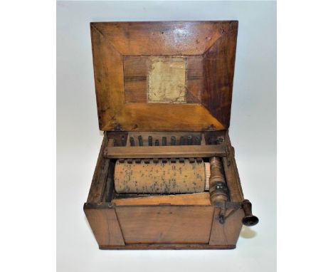 A very early small Serinette,French, circa 1790-1800, with 10 notes, single rank of metal pipes, early bellows layout, walnut