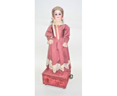 A large standing girl musical automaton, by L. Lambert, French circa 1890, with painted bisque head, moving inset blue eyes, 