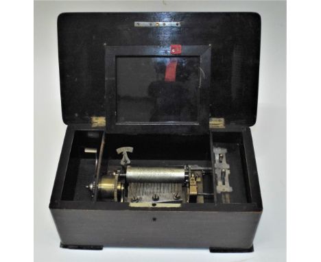 A small musical box playing four airs,Probably by Paillard, circa 1890, tune indicator, plain cast bedplate, in dark grained 