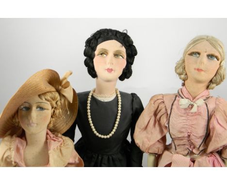 Four Boudoir dolls, 1920s, the first cloth doll with stockinette head, painted side-glancing eyes ,lashes, brows and mouth , 