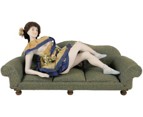 Rare large Galluba & Hoffman bisque Bathing Beauty, the figure reclining on a green patterned sofa, the Bathing Beauty with f