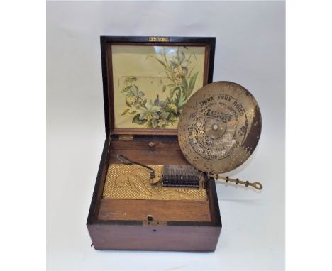 A Kalliope 9.1/4-inch disc musical box,Style 50, Ser. No. 115189, with single comb, gilt patterned bedplate, colour iris stud