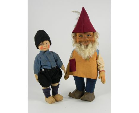 Bing Bros cloth boy doll, with painted features and brown hair, swivel head to cloth body with stitched fingers and wearing o