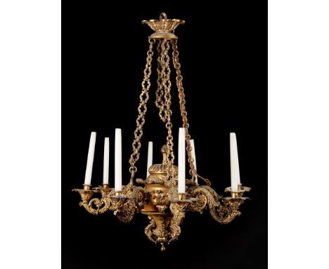 A FRENCH GILT BRASS EIGHT LIGHT CHANDELIER LAST QUARTER 19TH CENTURY With rich floral scrolling arms  Approximately 120cm hig
