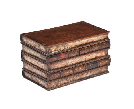 A GEORGE III WALNUT NOVELTY TEA CADDY IN THE FORM OF A STACK OF BOOKS LATE 18TH/ EARLY 19TH CENTURY The hinged top opening to