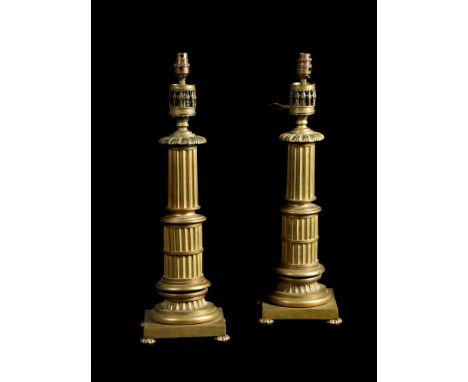 A LARGE PAIR OF BRASS COLUMNAR TABLE LAMPS 19TH CENTURY Of fluted tapering form, square plinth bases, now electrified each 59