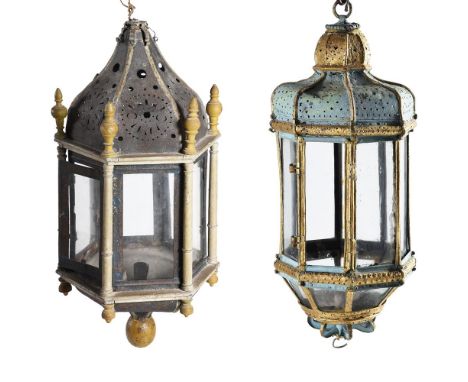 TWO HANGING LANTERNS 19TH CENTURY AND LATER The first pierced sheet metal and panted wood, hexagonal body57cm highThe second 