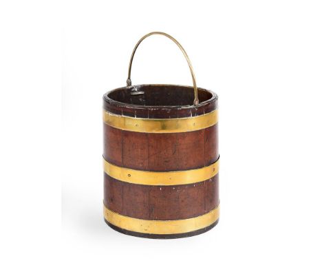 A GEORGE III MAHOGANY AND BRASS BOUND PEAT BUCKETCIRCA 1780Of coopered form34cm high, 30cm diameterProvenance: Property from 