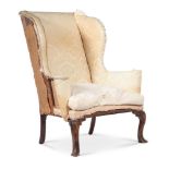 A GEORGE II WALNUT WING ARMCHAIR, CIRCA 1740