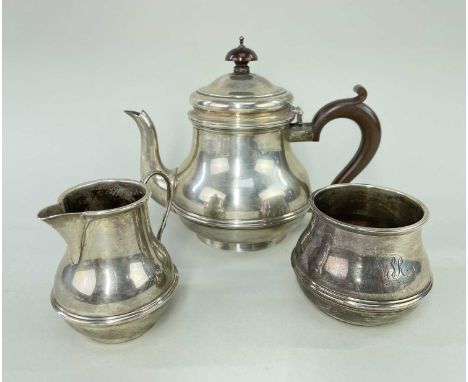 MATCHED THREE PIECE SILVER TEASET, Birmingham hallmarks, comprising teapot, cream jug and sucrier, engraved with initials and