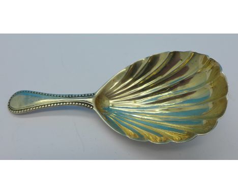 A silver caddy spoon