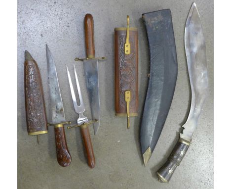 An Indian kukri with scabbard, a carving set and a carving knife (3)