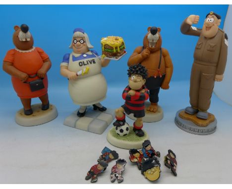 Five Dandy and Beano figures including Dennis the Menace, Ma Bear, Olive and pin badges