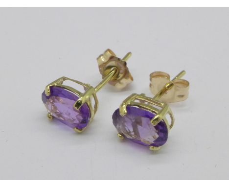 A pair of amethyst set earrings