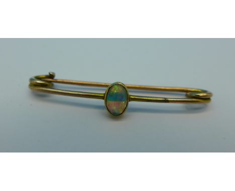 A yellow metal and opal brooch, 1g