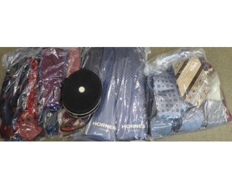 A collection of vintage ties and a bell boy cap