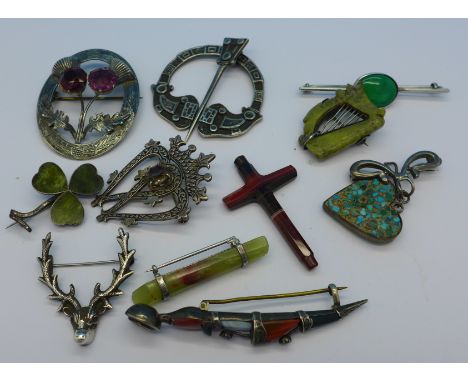 Three Scottish silver brooches, a silver mounted clover brooch, a dirk brooch, a harp brooch, etc.