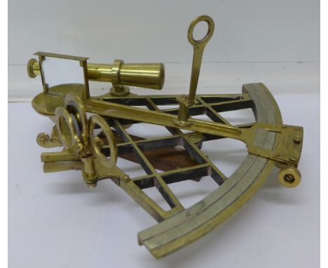 A brass sextant marked T. Cooke, London, No. 2319