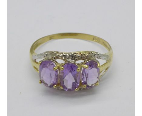 A 9ct gold, amethyst and diamond ring, 1.3g, N