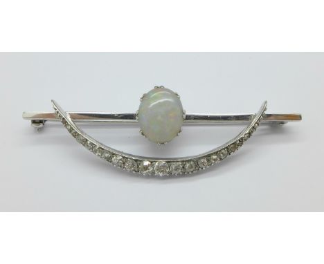 A white metal set, opal and diamond Art Deco brooch, 5.8g, 56mm